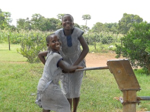 The children pumping water from their clean water well!