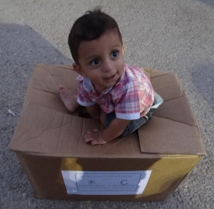 Thank you for your help to little boys like this precious one who is happily sitting on food and supplies for his family! You have provided them with HOPE! 