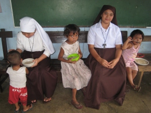 Some of our partners in the Philippines as they help to provide daily meals for the local children. 