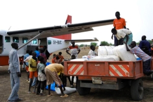 Unloading food and supplies for the children and families in the  Sudan. 