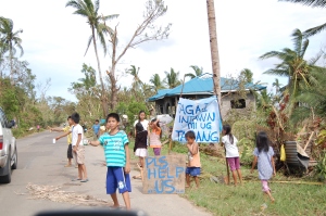 Children are accustomed to begging for food after the storms pass through in the Philippines. 